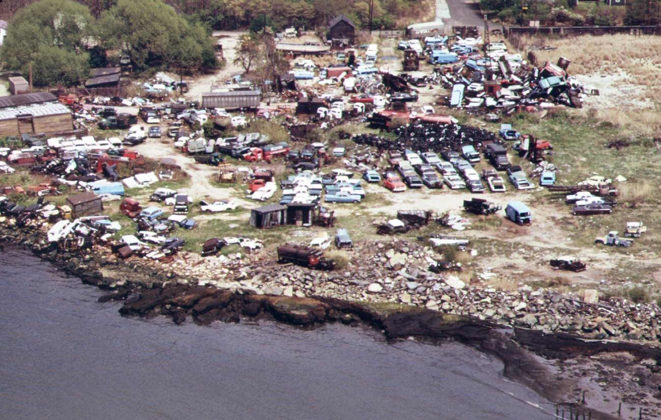 Auto wreckers and auto junk-yard on meridith avenue unwanted automobile bodies and parts are dumped into arthur kill, 1970s