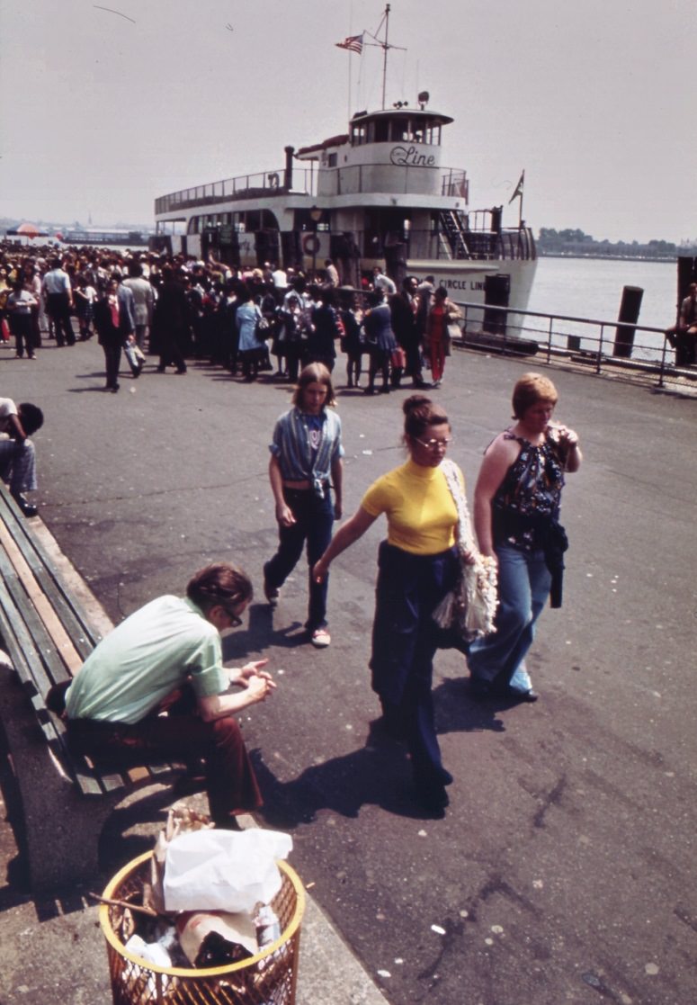 Battery park waterfront, lower manhattan. Staten island ferry in background, 1970s