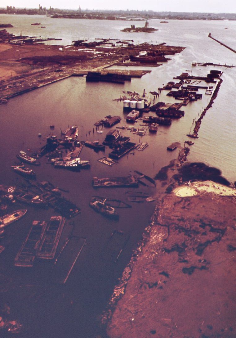 Abandoned small boats and barges rot in fresh kills, staten island, 1970s