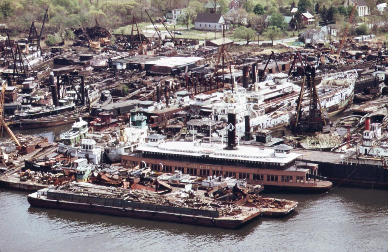 View from carteret, nj, across the arthur kill to staten island scrapyard and ship graveyard, 1970s