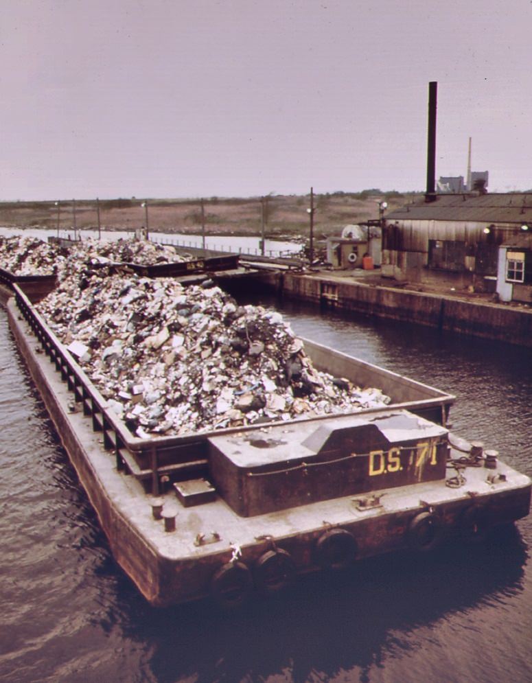 Garbage scow at fresh kills on staten island ready for unloading. Waste is used for landfill, 1970s