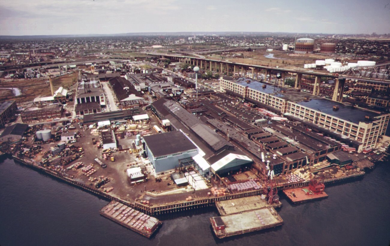 The phelps dodge copper refining center. Public warehouses on right beneath the goethals bridge to staten island, 1970s