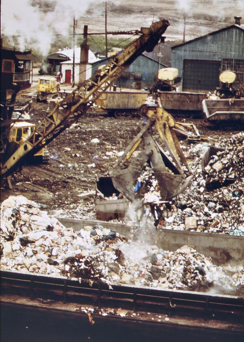 Landfill is loaded on barges for use at fresh kills, on the west shore of staten island, 1970s