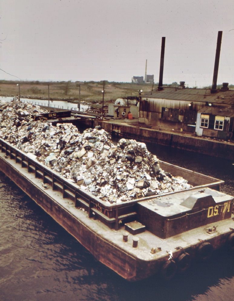 Garbage scow at fresh kills on staten island, just east of carteret, nj. Waste will be used as landfill, 1970s