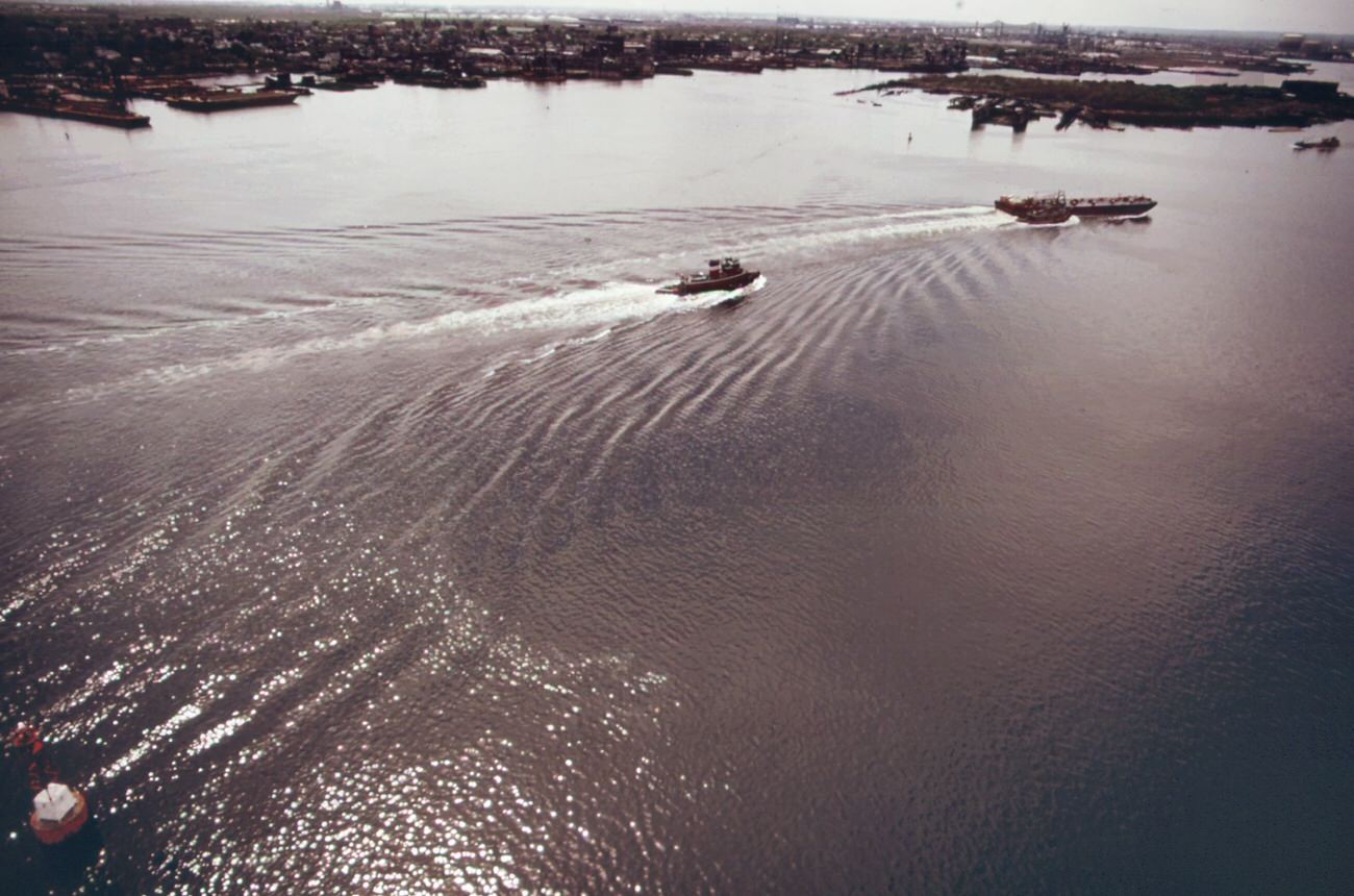 The mouth of arthur kill, the waterway which separates new jersey and staten island. It is the site of a huge petrochemical manufacturing complex, 1970s