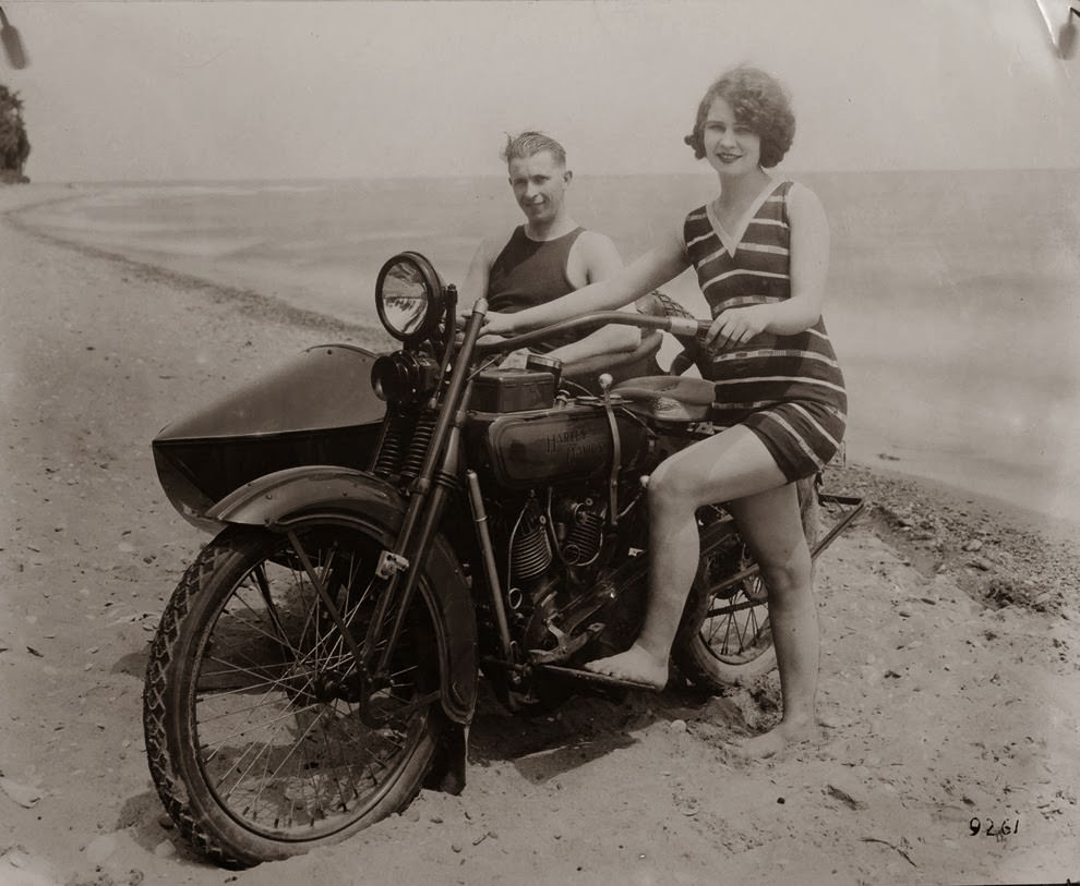 A woman alongside her harley-davidson in california, 1925.