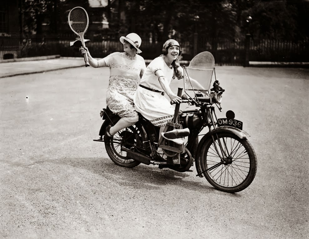 Two women ready to play tennis on a bsa motorbike, 1925.
