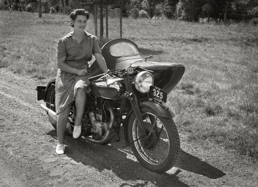 A woman with the royal enfield motorcycle and sidecar, ca. 1940s
