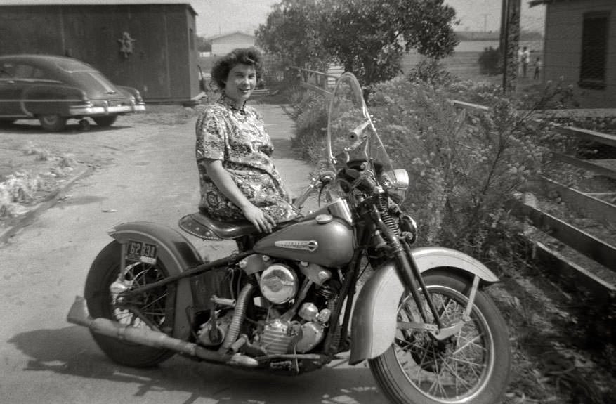 A woman posing with harley-davidson, california, 1953