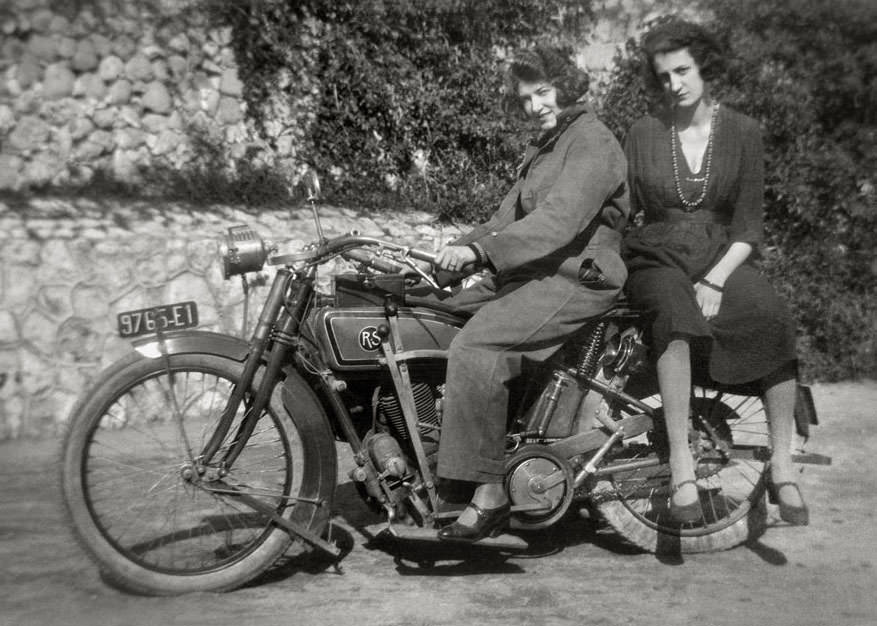 Ladies on a reading standard motorbike