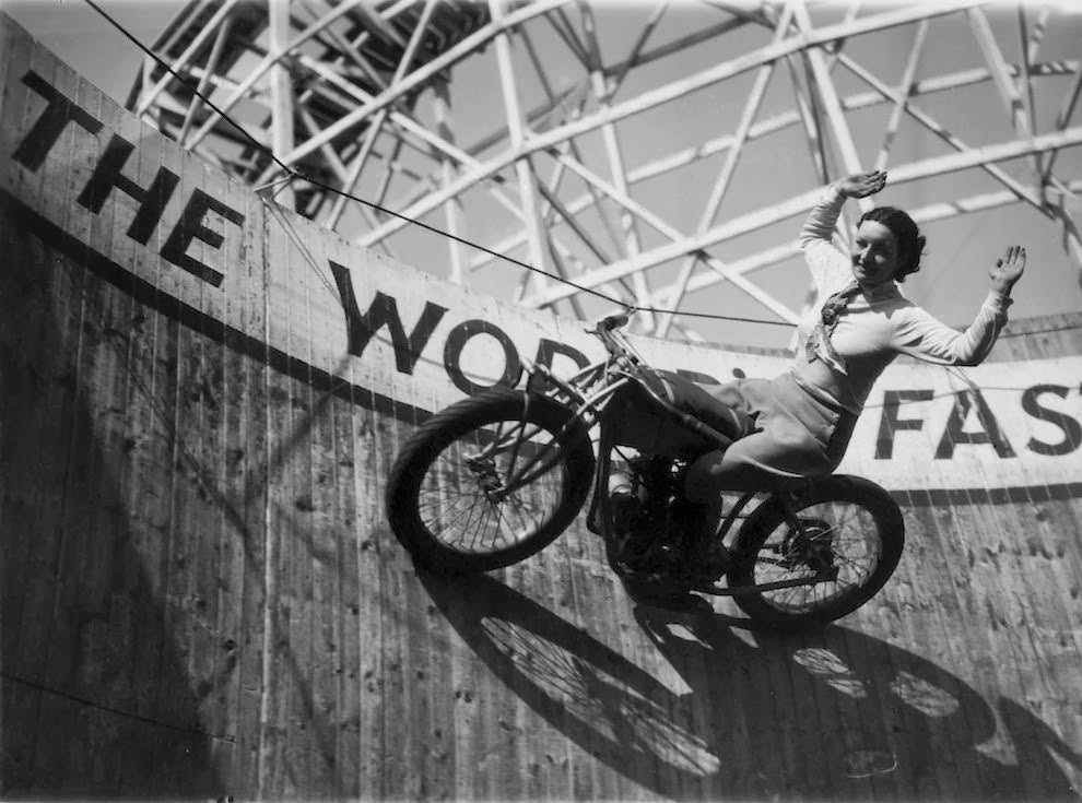 Marjorie dare (doris smith) riding hands free around “the wall of death” sideshow at the kursaal amusement park in essex, england, 1938.