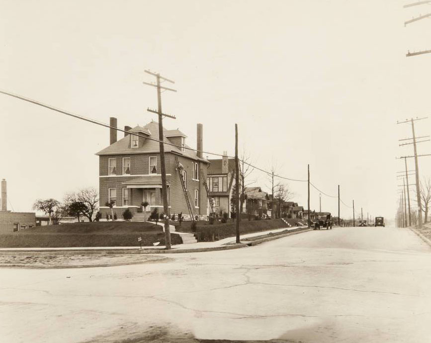 Men working on the tuckpointing of a house on the corner of Fyler Avenue and Watson Road in the Lindenwood Park neighborhood, 1930