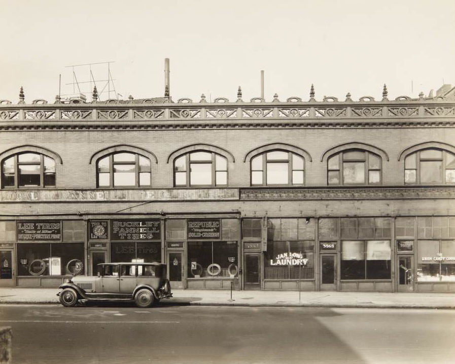 Storefronts along the 3500 block of Lindell Boulevard, including the Buckley-Pannell Tire Company, Jan Long Laundry, and the Union Candy Company, 1930
