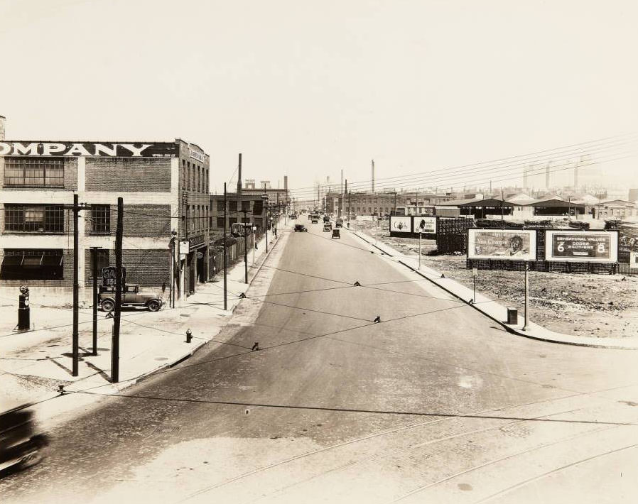 Buildings and billboards near the intersection of Market and Vandeventer, with the Firmin Desloge Hospital in the far distance and the building for the Globe Union Manufacturing Co. in the foreground, 1930