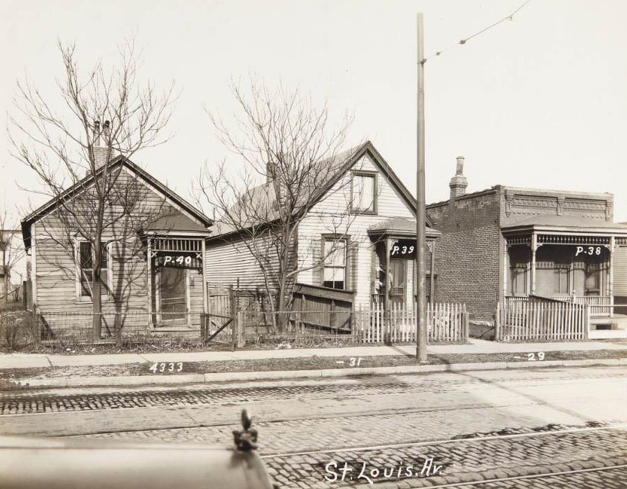Three small houses at 4333-4329 St. Louis Ave. with a mailman delivering at 4331, 1930