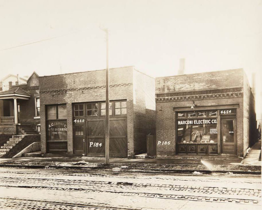 Two buildings located on the 4600 block of St. Louis Ave. A.C. Garage Auto Repairing Storage Space was at 4652 and the Marconi Electric Co. at 4654, 1930