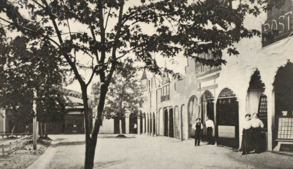 The Pike, Forest Park Highlands, St. Louis, 1930 - Photograph of The Pike, the concession area, at Forest Park Highlands. Several male and female employees stand by their booths.