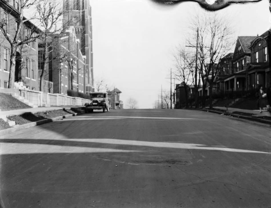 View of the 5900 block of Minerva Ave. St. Barbara Catholic Church (now St. Augustine is visible at Minerva and Hamilton, 1930