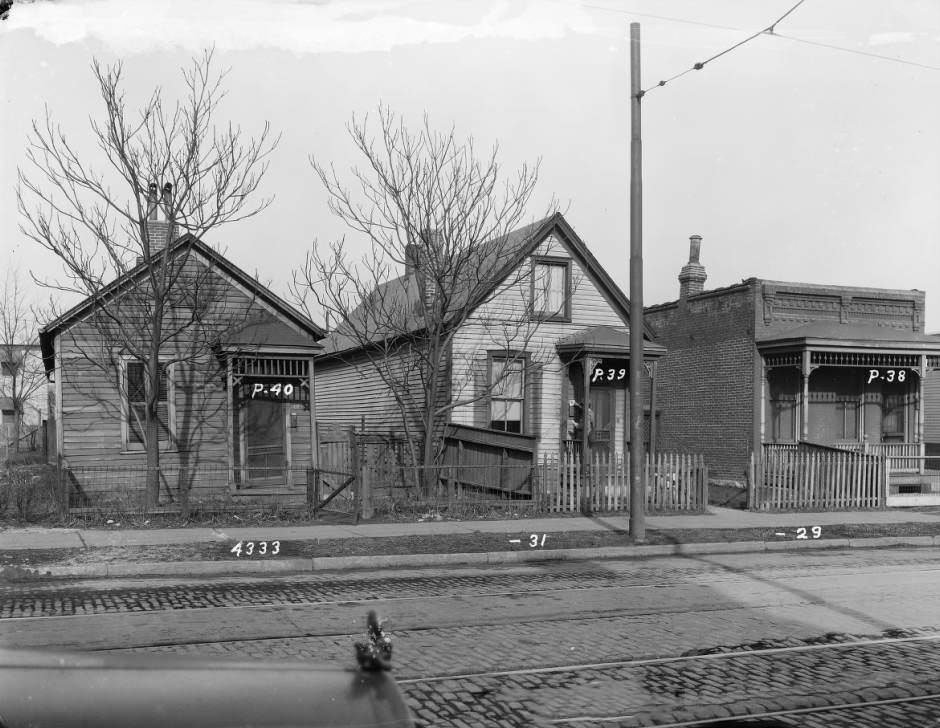 View of three one-story frame houses at 4333 - 4331 - 4329 St. Louis Ave, 1930