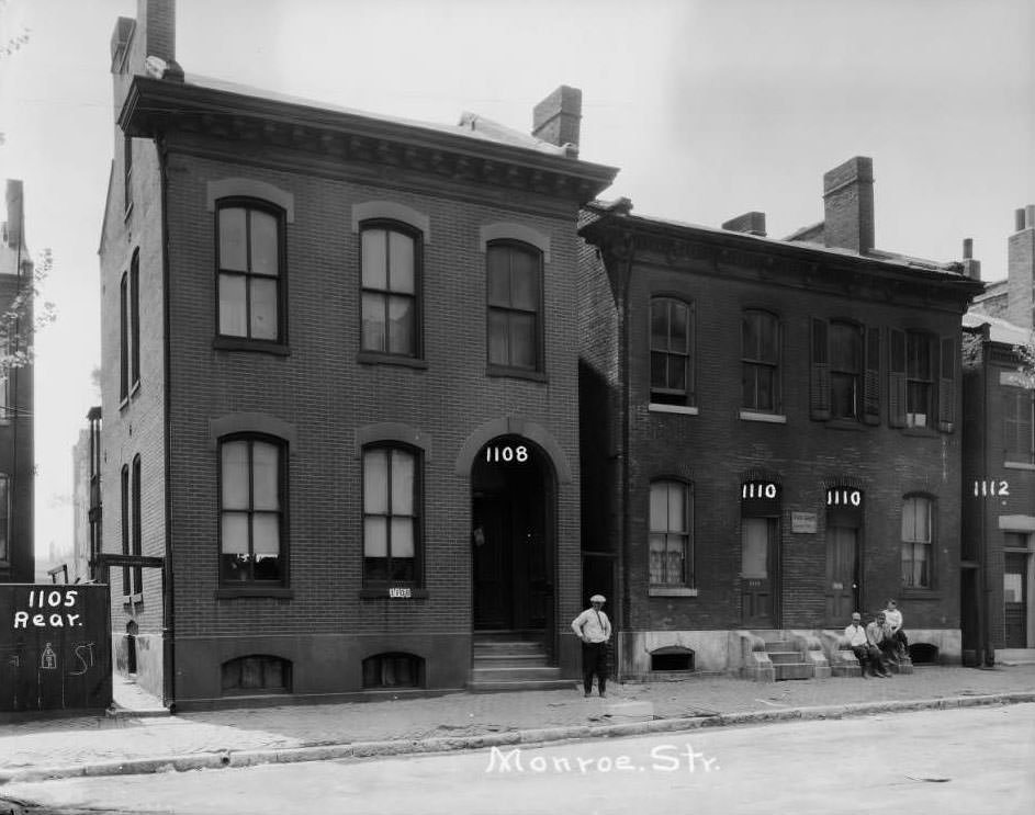 View of residences on the 1100 block of Monroe St. near Webster School in the Old North St. Louis neighborhood, 1930