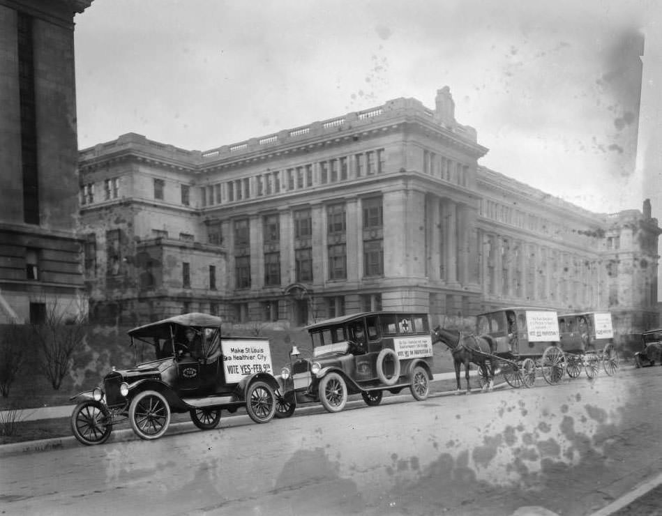 Fleet of Division of Health vehicles and horse-drawn wagons in front of the Municipal Courts Building, 1930