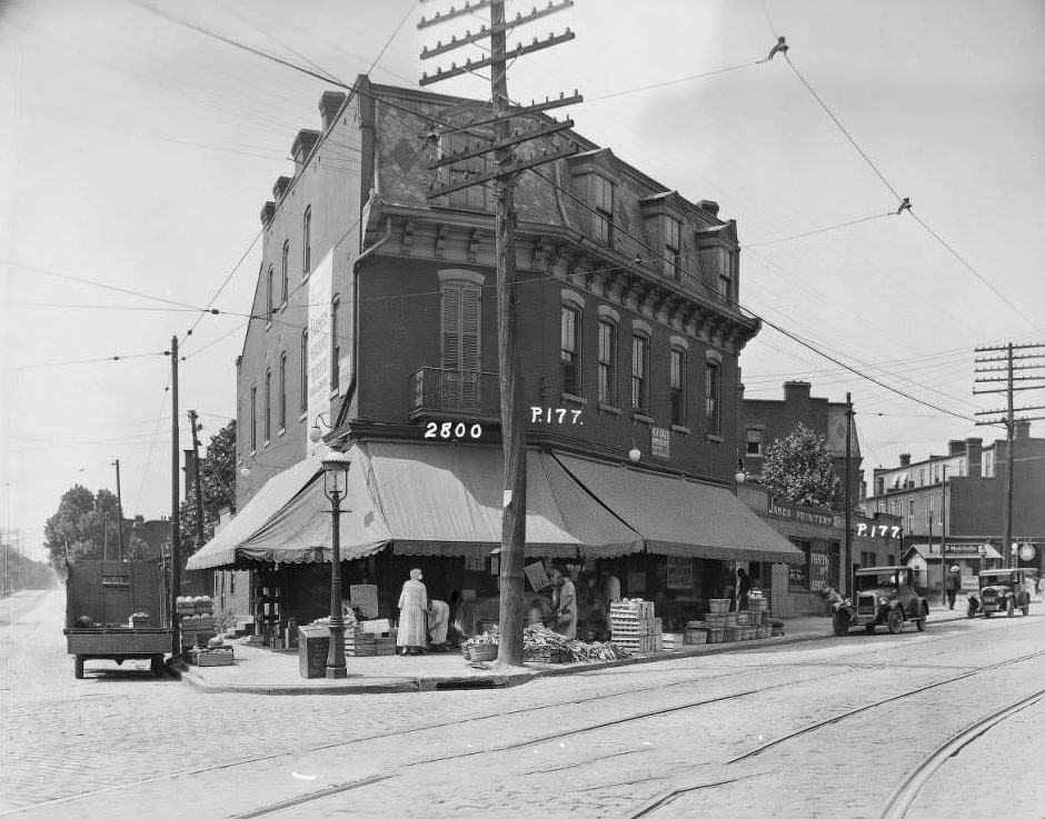 Building that housed Schenberg's Market at southwest corner of California and Gravois with James Printery next door, 1930