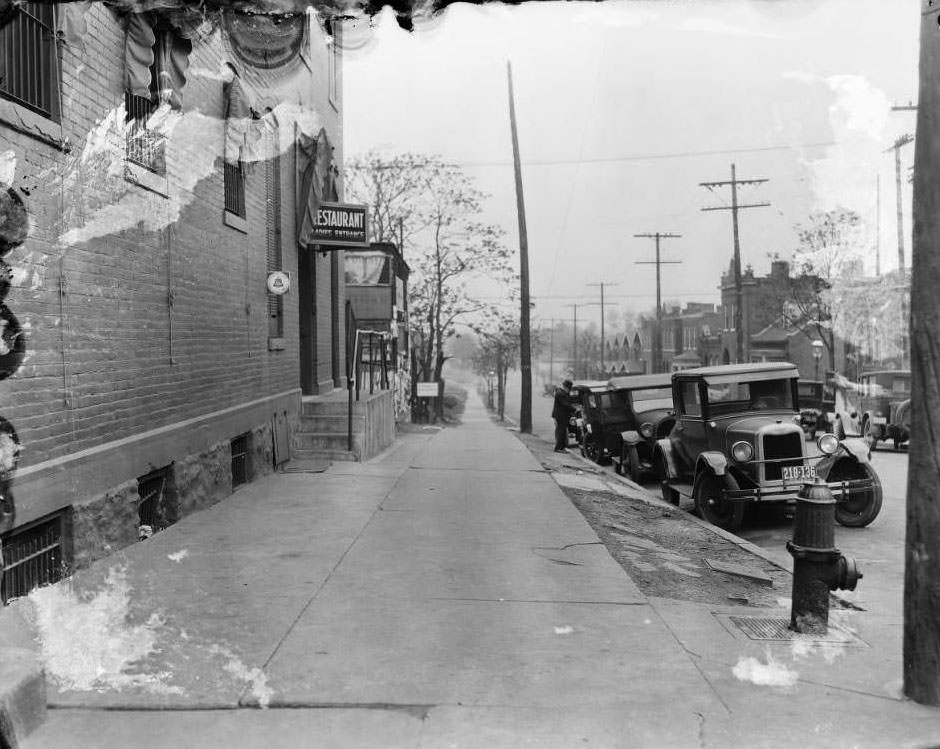 View down 4100 block of Virginia Ave. from northwest corner of Virginia Ave. and Meramec St. with "Restaurant Ladies Entrance" on 3301 Meramec's awning, 1930