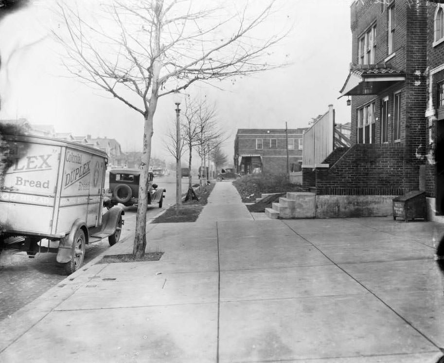 View looking north down Grand Ave. from northeast corner of South Grand Blvd. and Fillmore St. with various buildings visible, 1930