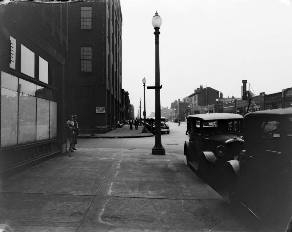Intersection at Morgan (now Delmar and 17th St. with signage for Hecht-Lears Clothing Manufacturers and various other businesses visible, 1930