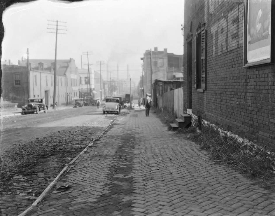 View down southside of Carroll St. at intersection with Seventh St. with South Broadway visible, 1930