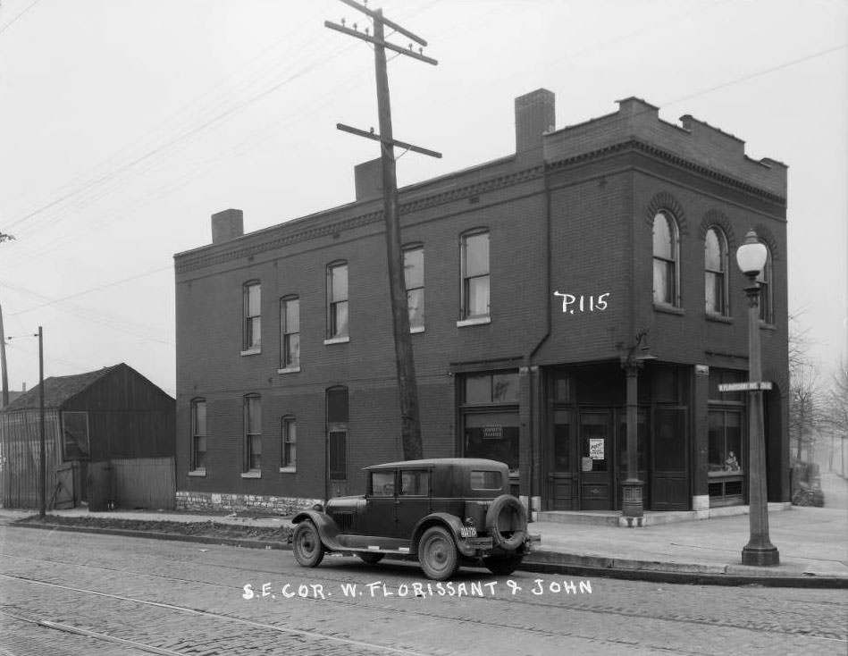 Corner storefront at 4338 John Ave. that was home to Joost's Market with advertisement for Krey's Head Cheese on the door, 1930