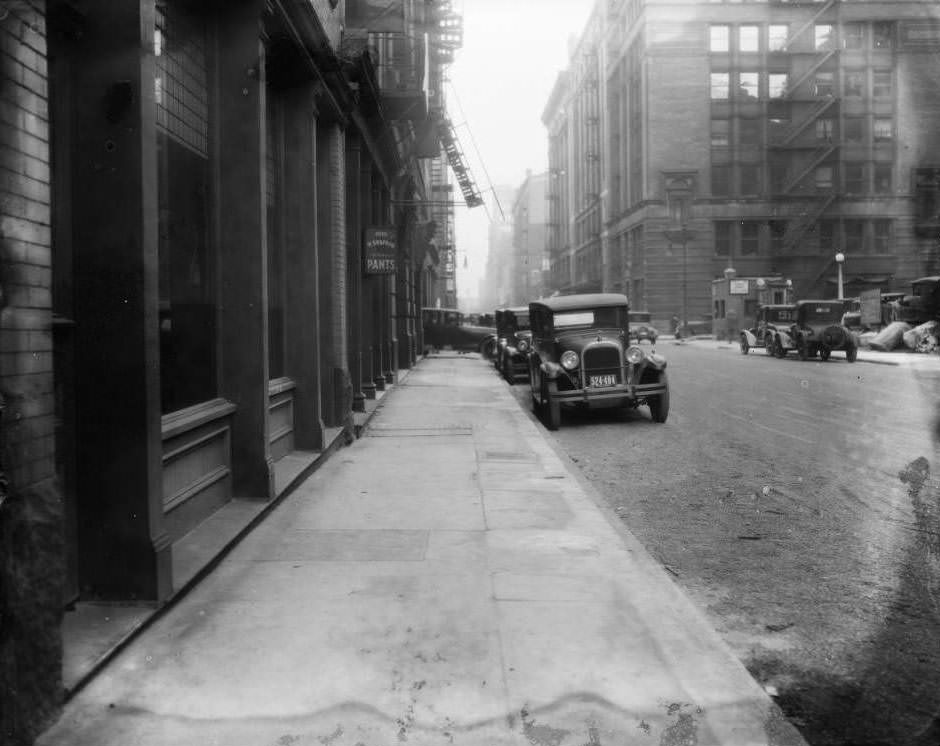 View east down Lucas Ave. towards 9th St. with H. Siegfried Fine Pants store and Lammert Furniture Building visible, 1930