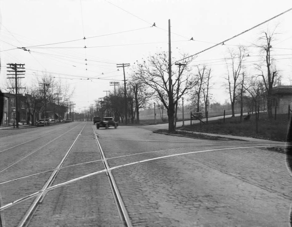 View south on N. Broadway at intersection with East Carrie Ave. with trolley tracks turning into St. Louis Public Service Co. Broadway & Taylor Car Station, 1930
