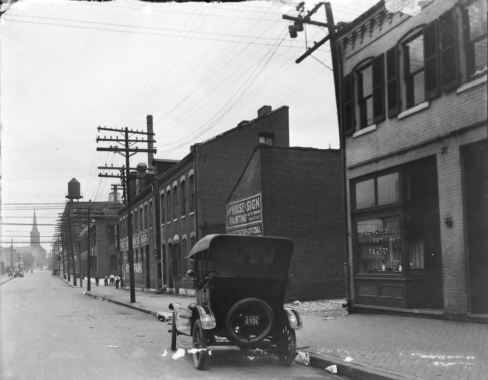 View north on 13th Street from Cass Ave. Six-story Robert, Johnson & Rand Shoe Co. building and Independent Evangelical Protestant Church are visible, 1930