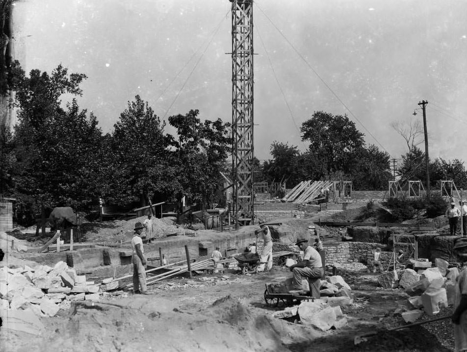 View of several construction workers on a large building site, 1930