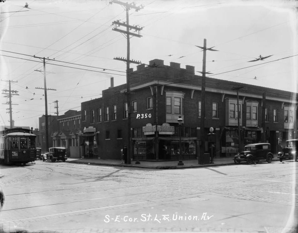 Large commercial building at Union and St. Louis Avenues, home to Peters Shoes and Mound City Restaurant, 1930