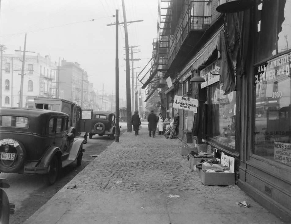 View of 1900 block of S. Broadway near Geyer Ave. Dry cleaning business at 1910 owned by Frank Kembleger visible, 1930