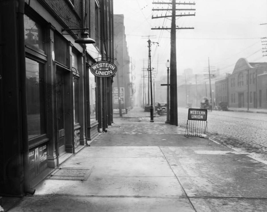 View of North Broadway and Monroe Street. Western Union office at 2221 N. Broadway visible, 1930