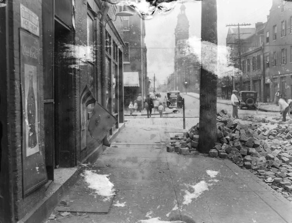 View of N. 10th St. and Biddle, with the spire of Shrine of St. Joseph visible in the background, 1930