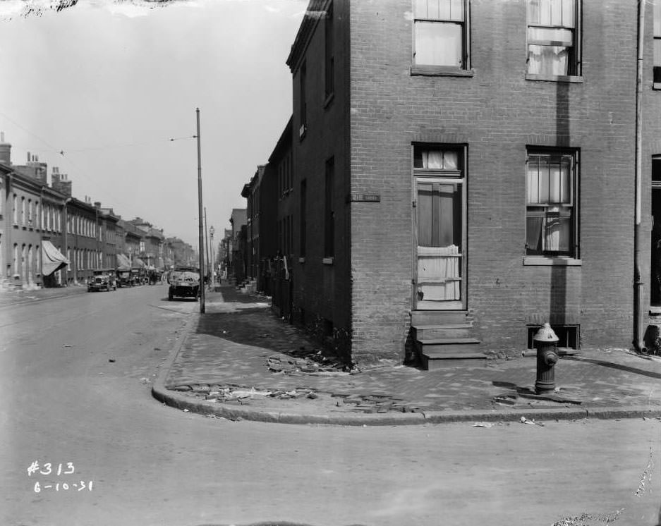 View of intersection of Biddle St. and North 21st St., with house at 1130 North 21st St. in foreground, 1931.