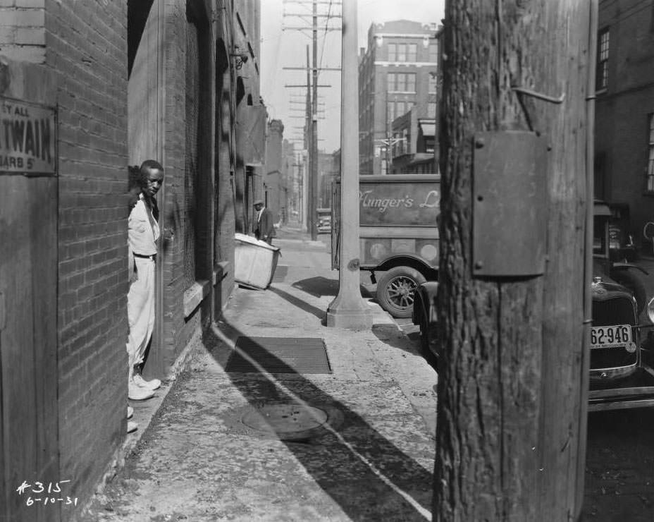 Munger's Laundry Rear, alley view with delivery truck and people behind Munger's Laundry Company, 1931