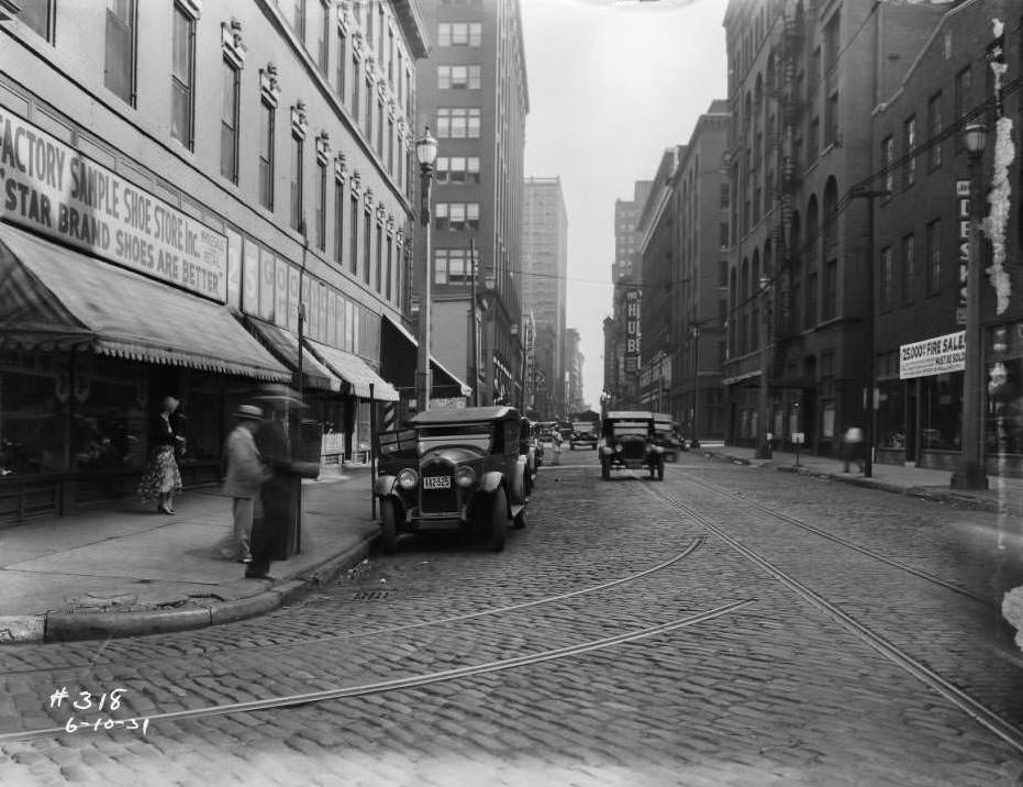 Looking south down North Seventh Street from intersection with Morgan Street, view of The Hub furniture store, Richman Brothers, and Busy Bee Candy Co, 1931