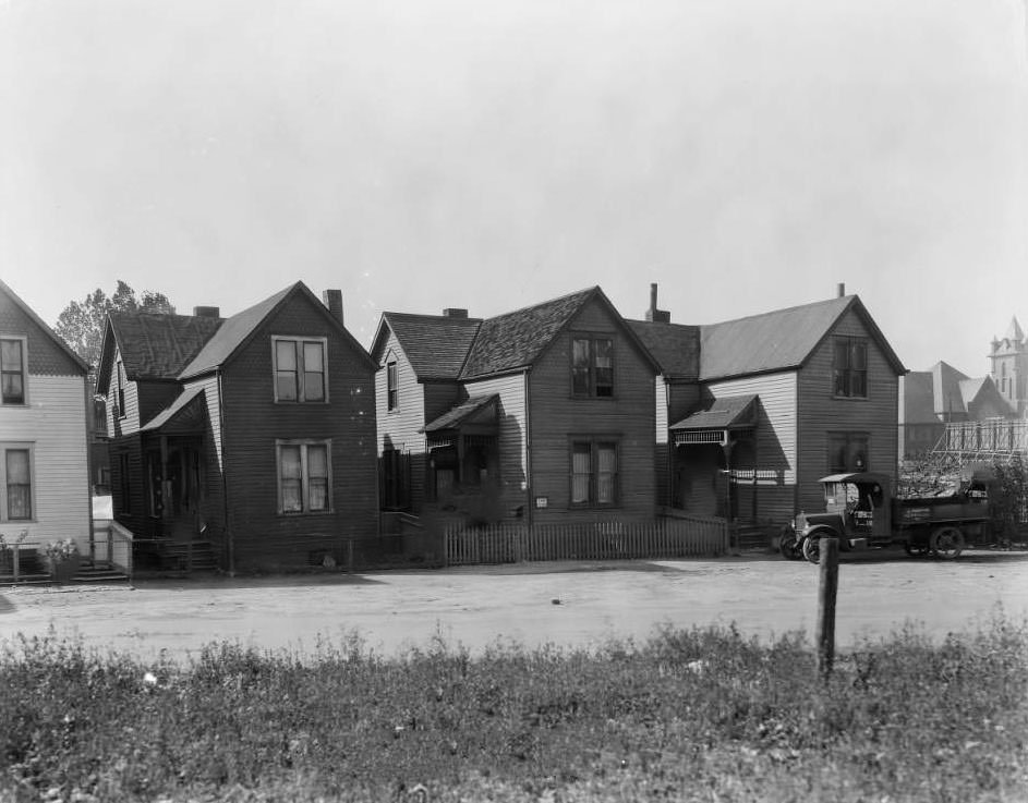 Four two-story frame homes on the 4400 block of North Florissant Avenue between Pleasant and Bissell Streets, with Martin's truck parked in front of his home, 1930
