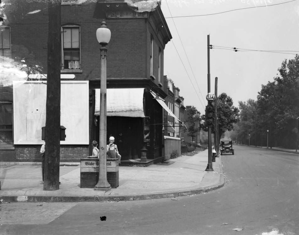 Boys sell newspapers at Jefferson and Arsenal in 1930.