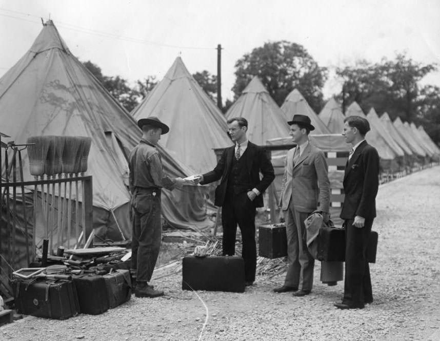 Men in suits visit a man with either long legs or short pants in 1930.