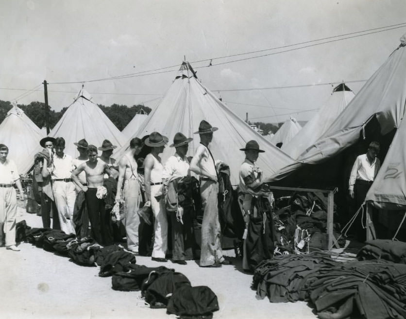 C.M.T.C. student campers "deprocessing" at Jefferson Barracks after a month in khaki. Lined up to get back civilian clothes, 1930