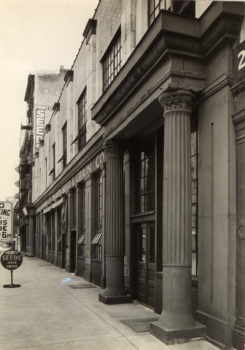 Prunty Seed Company now occupies the squat and substantial building at 14-16 South First Street, marked by two sets of stone pillars at the entrance, which has been in business since 1874, 1930