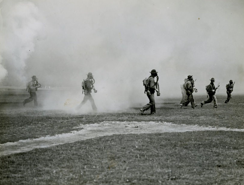 Sixth Infantry charges through gas during demonstration at Jefferson Barracks baseball diamond, 1930