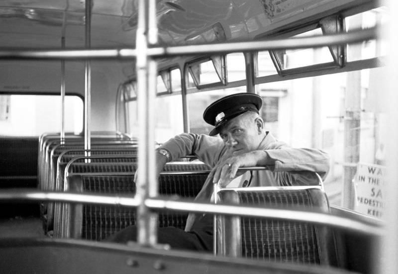 Driver Luscombe takes a break on the top deck, Paignton bus station, 1970