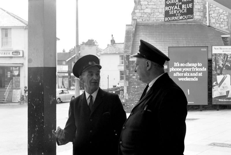 The bus station regulators discuss strategy at Paignton bus station, 1970